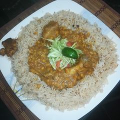 A picture of Dal gosht with Zeera rice.