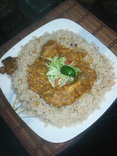 A picture of Dal gosht with Zeera rice.
