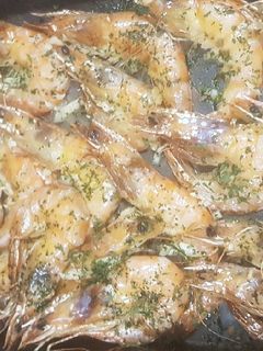 Una foto de Langostinos al vino