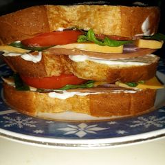 A picture of Delicous Triple Decker Ham Sandwich.