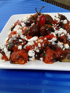 A picture of Mini Eggplants with Tomato Feta Sauce.