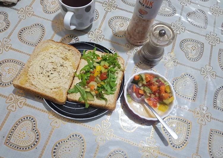 Humus sandwich with rocket and crunchy bright salad