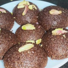 A picture of Bourbon Biscuit Cake Baked in Appam Pan.