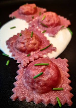 A picture of Beet Ravioli Stuffed with Amberjack on Buffalo Cream.