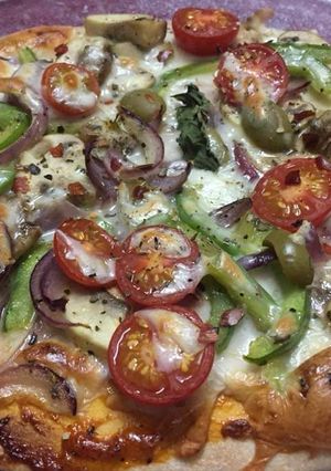 A picture of Cheesy.Tomato.Mushroom Pizza.