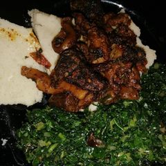 Wet fry matumbo (Tripe) with sautéed kales A picture of Wet fry matumbo (Tripe) with sautéed kales.