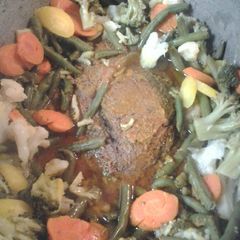 A picture of Roasted buttered beef and vegetables.