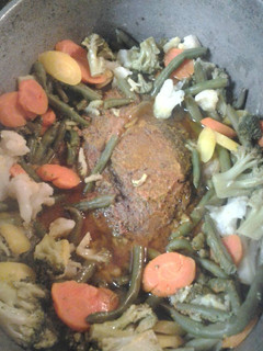 A picture of Roasted buttered beef and vegetables.