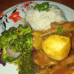 A picture of Mutton curry with broccoli.