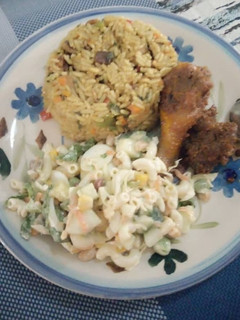 A picture of Caribbean Rice with vegetable pasta salad with beef and chicken.
