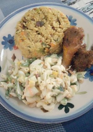 A picture of Caribbean Rice with vegetable pasta salad with beef and chicken.