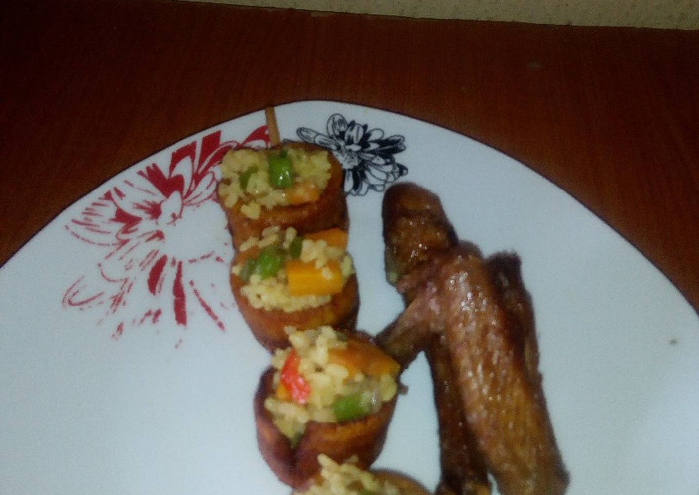Fried rice in Skewed Plantain rings and fried Chicken