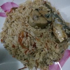 A picture of Jollof Rice and Iced Fish.