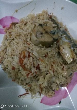 A picture of Jollof Rice and Iced Fish.