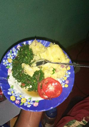 A picture of Mashed banana/potatoes and fried kales.