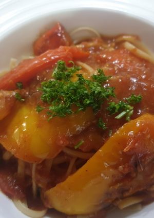 A picture of Peppers in a tomato sauce.