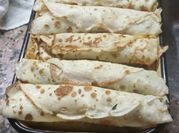 Una foto de canelones de acelga
