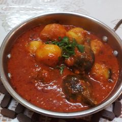 A picture of Stuffed Brinjals and Baby Potatoes Sabzi.