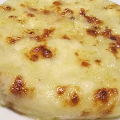 A picture of Frico - cheese, onion and potato pie.