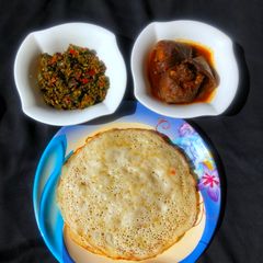A picture of Sinasir with stir fry spinach and soup.