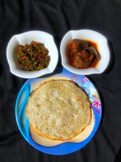 A picture of Sinasir with stir fry spinach and soup.