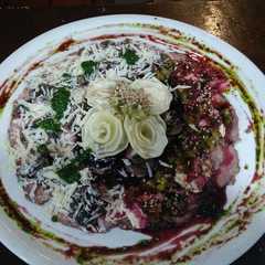 Una foto de Trío de carpaccio
