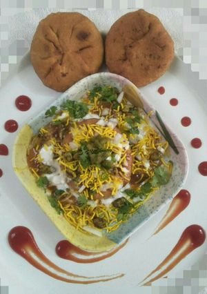 A picture of Poha pyaz ki kachori chat.
