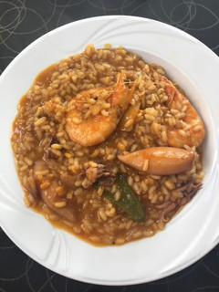 Una foto de Arroz meloso de calamares 🦑