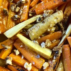 A picture of Roasted root vegetables with a miso-honey dressing.