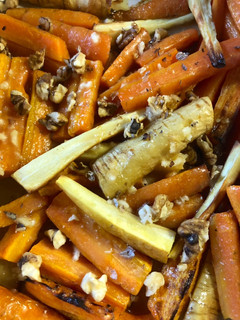 A picture of Roasted root vegetables with a miso-honey dressing.