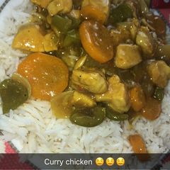 A picture of White rice and Curry chicken soup.