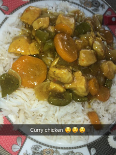 A picture of White rice and Curry chicken soup.