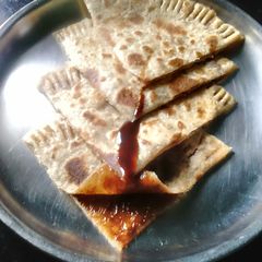 A picture of Chocolate syrup paratha.
