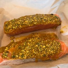 A picture of Salmon with pistachio and turmeric crust.