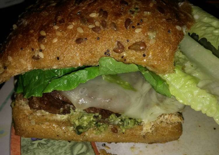 Michael's FLG (Finger Licking Good) Angus beef and basil Pesto cheeseburger with provolone and sun dried tomatoes Michael's FLG (Finger Licking Good) Angus beef and basil Pesto cheeseburger with provolone and sun dried tomatoes