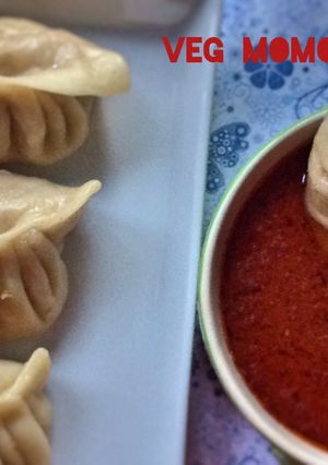 A picture of Vegetable Momos with Spicy Chilli Sauce.
