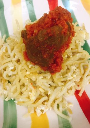 A picture of Noodles and stewed beef.