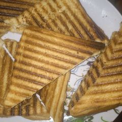 A picture of Toasted bread with hot tea or.