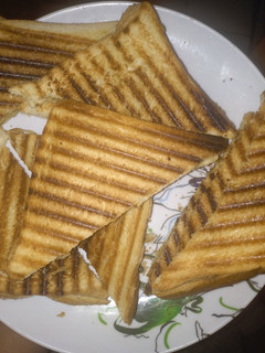A picture of Toasted bread with hot tea or.