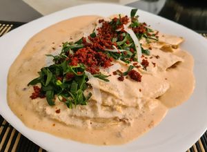 Una foto de Enchiladas blancas