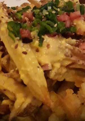 Una foto de Papas con cheddar y panceta