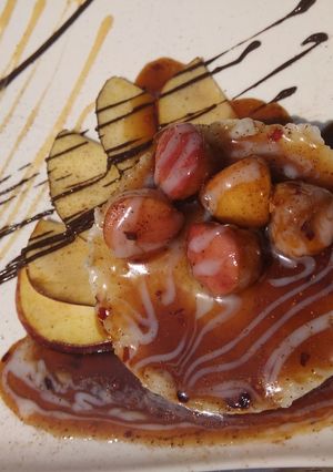 A picture of Coconut Rice Pudding with Apple Carimal Sauce.