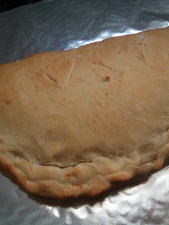 Una foto de Calzone de calabacín y queso de cabra