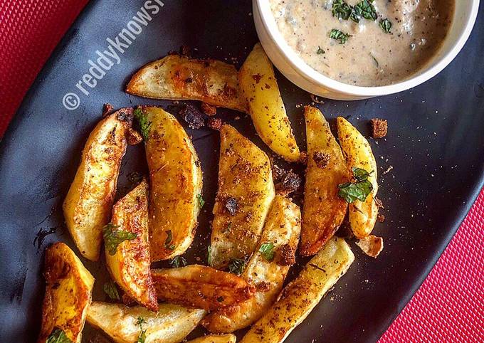 Baked Spiced potato wedges with garlic Bechamel sauce