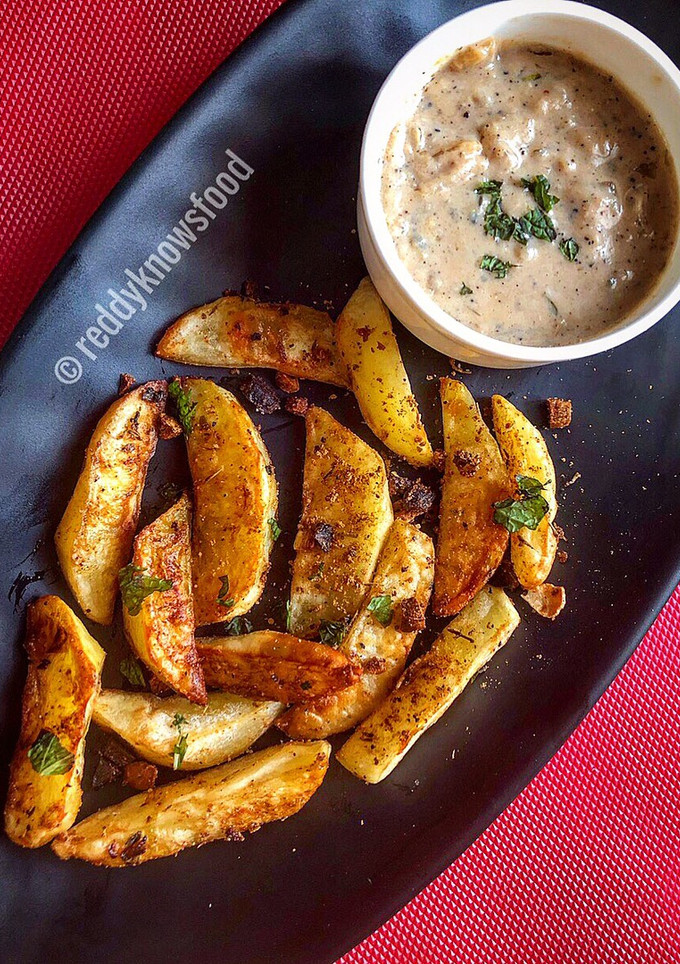 A picture of Baked Spiced potato wedges with garlic Bechamel sauce.