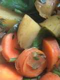 Vegetable curry with carrots, carrot tops, potatoes and spinach