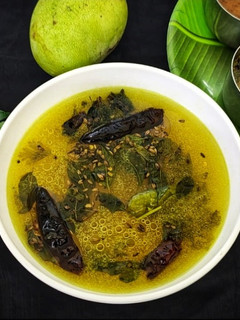 A picture of Mavinakaayi Saaru/ Andhra Style Raw mango Rasam.
