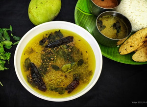 A picture of Mavinakaayi Saaru/ Andhra Style Raw mango Rasam.