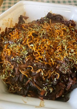 A picture of Chinese Noodles with Porcini Mushrooms and Carrot.