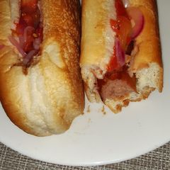 A picture of Choma sauce/Ketchup hot dogs.